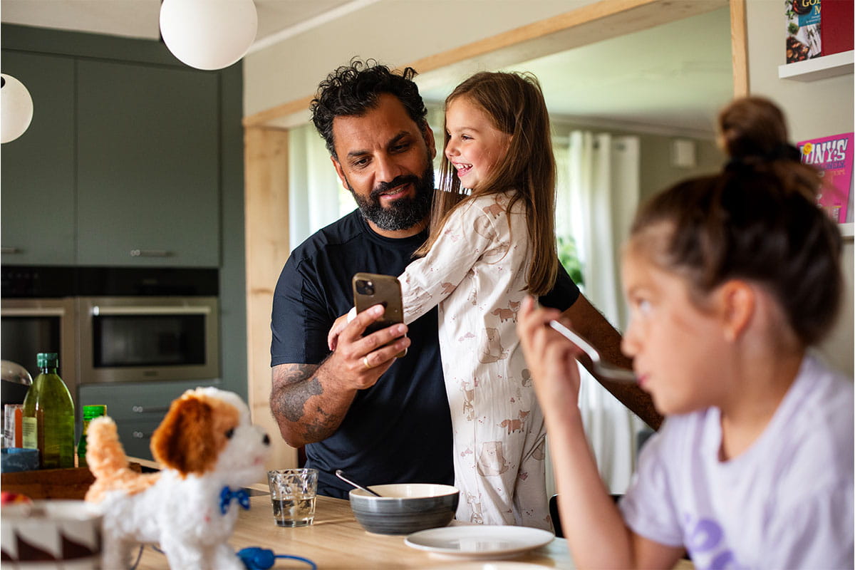 Family spending time together in a kitchen.
