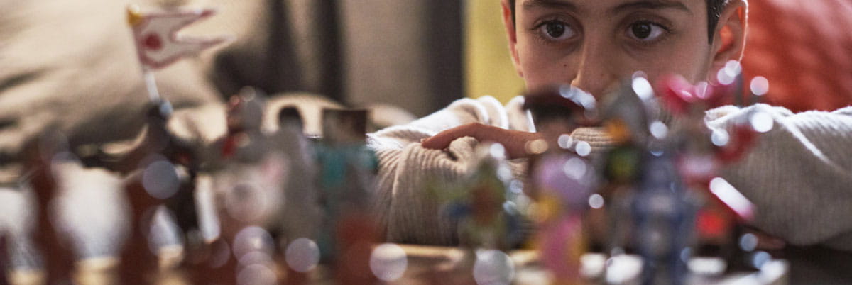 Boy playing game of chess
