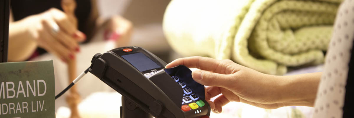 Customer inputting PIN into card reader
